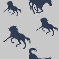 Blue silhouettes of sports horses isolated on a  colored background Royalty Free Stock Photo